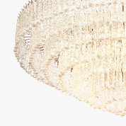 подвесная люстра с коническим силуэтом из множества стеклянных элементов