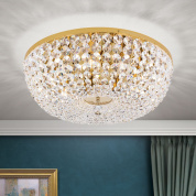 крупная потолочная люстра с массивным кристальным плафоном и золотой декоративной чашей