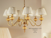 подвесная люстра с тремя источниками света и текстильными абажурами на латунной раме