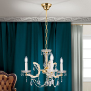 трёхрожковая хрустальная люстра с изогнутой арматурой в золоте