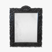 настенное зеркало с объёмной чёрной рамой и барельефным орнаментом