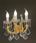 настенное бра с изогнутыми рожками и кристальными подвесками