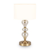 настольная лампа с тканевым абажуром и декоративным стеклянным основанием на латунной подставке