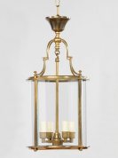 подвесной фонарь цилиндрической формы с прозрачными стеклянными стенками в латунной раме