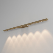 линейный настенный светильник интерьерной подсветки с рядом направленных светодиодных источников света золотистого цвета