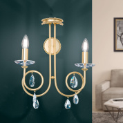 двухламповое настенное бра с изогнутой арматурой под матовое золото и хрустальными подвесами