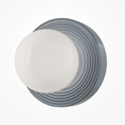 — настенный светильник серого цвета с концентрическим рельефом и матовым стеклянным плафоном