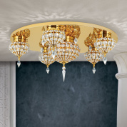 многоярусная потолочная люстра с пятью декоративными кристальными секциями и золотистой рамой