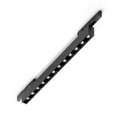 трековый линейный светильник с вытянутым металлическим корпусом и несколькими источниками света