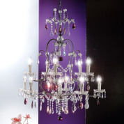 многоярусная хрустальная люстра с многочисленными свечными рожками и каскадными подвесками