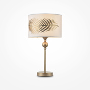 настольная лампа с золотистой основой и абажуром с растительным орнаментом