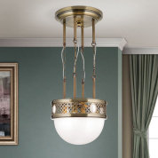 подвесной светильник с цилиндрическим стеклянным блоком и латунной перфорированной оправой