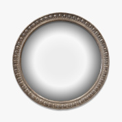 круглое настенное зеркало с тонкой резной рамой в классическом стиле