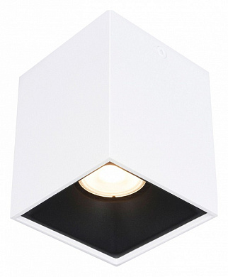 потолочный спот с белым корпусом и направленным световым пучком