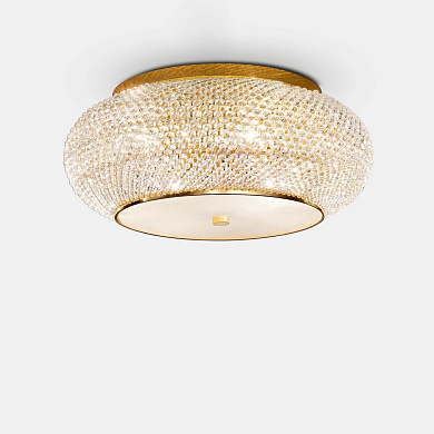 потолочный светильник с круглым корпусом и декоративным золотым покрытием
