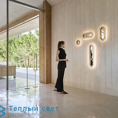 настенный светильник кольцевой формы белого цвета